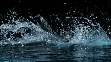 Clear water splash on a black background , close-upの写真素材