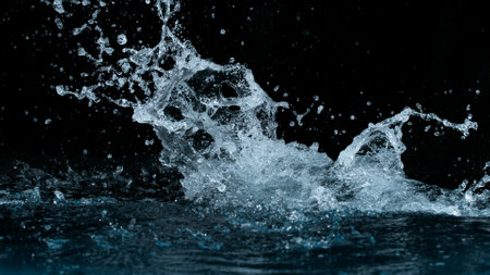 Clear water splash on a black background , close-upの写真素材