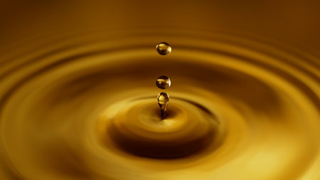 Freeze Motion of Splashing Whiskey or Cider Drop. Super Macro Shot, Extreme Close-up.の写真素材