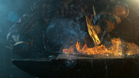 Close-up of blacksmith forging glowing hot iron on anvil with flying sparks