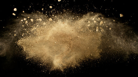 Freeze Motion Shot of Flying Soil , Isolated on Black Background