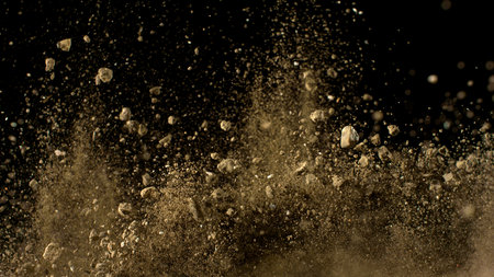Freeze Motion Shot of Flying Soil , Isolated on Black Backgroundの写真素材