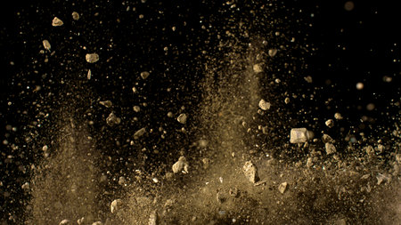 Freeze Motion Shot of Flying Soil , Isolated on Black Backgroundの写真素材