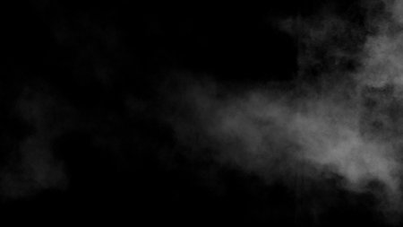 Freeze motion of atmospheric smoke isolated on black backgroundの写真素材