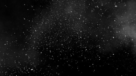 Freeze motion of snow and atmospheric smoke isolated on black backgroundの写真素材