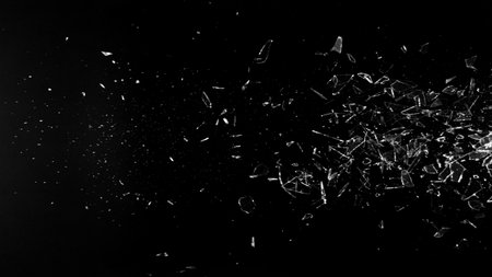 Freeze Motion Shot of Breaking Real Glass Isolated on Black Backgroundの写真素材