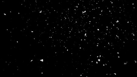 Freeze motion of natural snow falling on black backgroundの写真素材