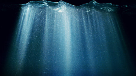 Dark Blue Ocean Surface Seen from Underwater. Abstract Waves and Rays of Sunlight Shining Throughの写真素材