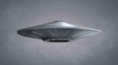 UFO spaceship with yellow light beam isolated on grey background. Vector illustrationのイラスト素材