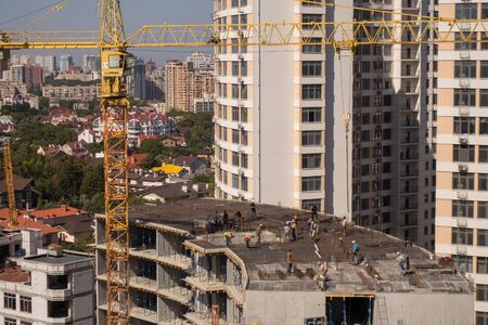 The construction of a multi-storey modern house on the seashore. Installation of floor reinforcement. Tower cranes. September 9, 2019. Odessa. Ukraineのeditorial素材