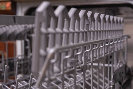 Dishwasher, gray mesh dishwasher. Selective focus