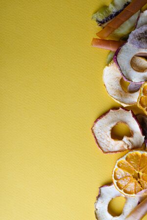 Dried fruits on a yellow background and place for an inscription. Copyspace.の写真素材