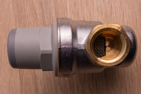 White coated bronze pressure relief valve for domestic water supply. Water reducer 1/2 inch adjustableの写真素材