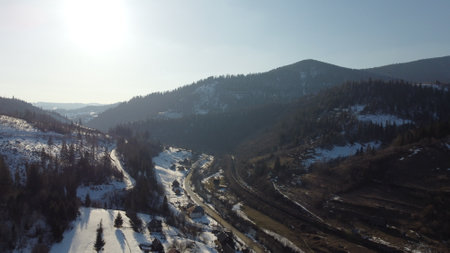 Drone shot. View of the village at the foot of the mountains. Carpathians. Ukraineの写真素材