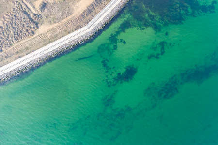 Seashore with turquoise water. Conceptual photo - sea and coast. Helicopter viewの写真素材