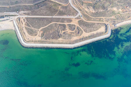 Seashore with turquoise water. Conceptual photo - sea and coast. Helicopter view