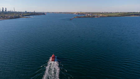 Pilot boat at sea in the port water area. Aerial viewの写真素材