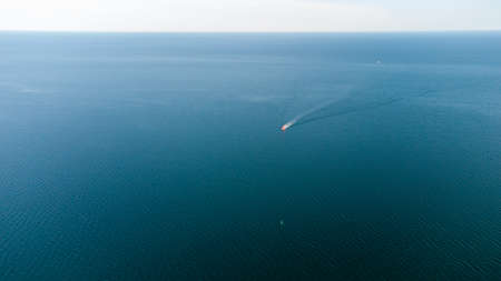 Pilot boat at sea in the port water area. Aerial view