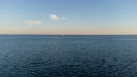 Calm sea at dawn. Blue sea and cloudsの写真素材