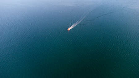 Pilot boat at sea in the port water area. Aerial viewの写真素材