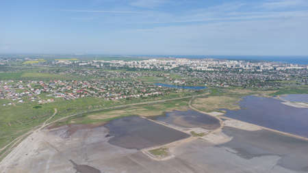 The bottom of a dried up salt lake. View from the air. Traces of cars and motorcycles in the sandの写真素材