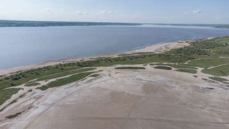 The bottom of a dried up salt lake. View from the air. Traces of cars and motorcycles in the sandの写真素材