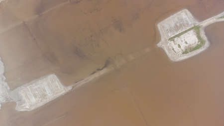 The bottom of a dried up salt lake. View from the air. Traces of cars and motorcycles in the sandの写真素材