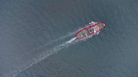 Fire boat on duty in the port water area. Aerial viewの写真素材