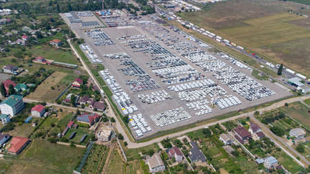 Empty parking lots, aerial view. A lot of cars in the parking lot. Colorful moody drone shootの写真素材