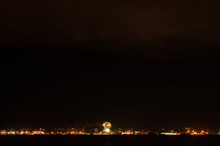 Fireworks and fireworks in the big city. view across the bayの写真素材