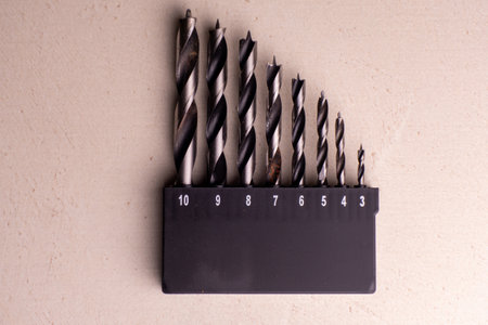 A set of wood drills in a container. Joiner's hand toolの写真素材