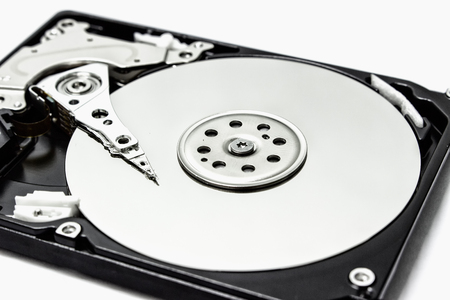 Inside a hard drive with a data plate and a needle for reading and writing data.の写真素材