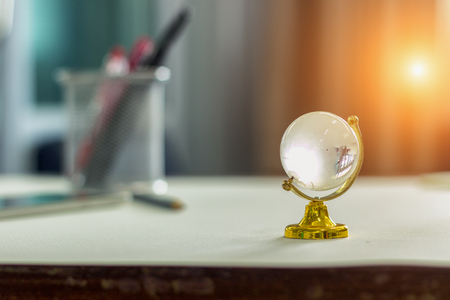 Globe glass model on the desk.の写真素材
