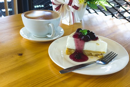 Blueberry Cheese pie with coffee ready for the day.の写真素材