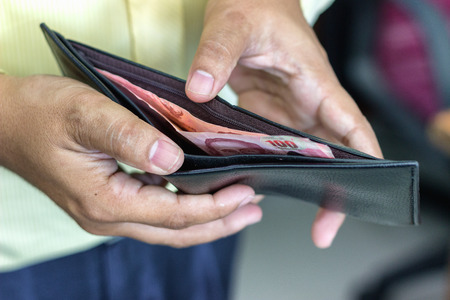 Men are opening an empty wallet.
