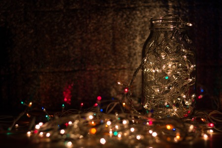 wood table with background garland lights from ledの写真素材