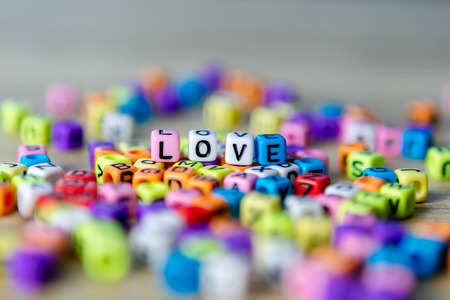 Beautiful beads colorful placed on the table as Loveの写真素材