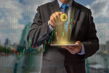 Transactions on the Internet by trading through bitcoin currency blockchain technology through financial data through secure wallet makes it important for future global economic system investments.の写真素材