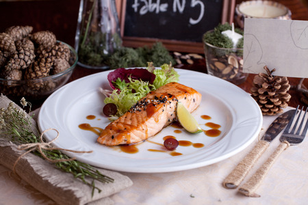 red fish with green grapes and sauceの写真素材