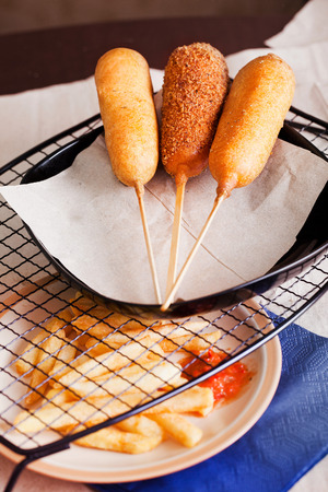 korndog with french fries and ketchup in a still lifeの写真素材