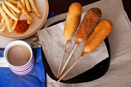 korndog with french fries and ketchup in a still lifeの写真素材