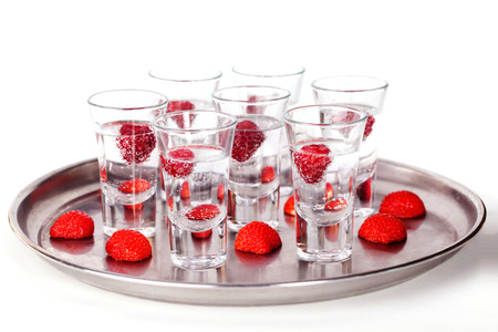 set of short cocktail with raspberries and strawberries on a tray on a white の写真素材