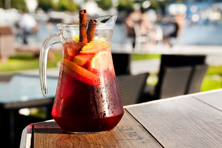 sangria with red wine in a jug on the boardsの写真素材
