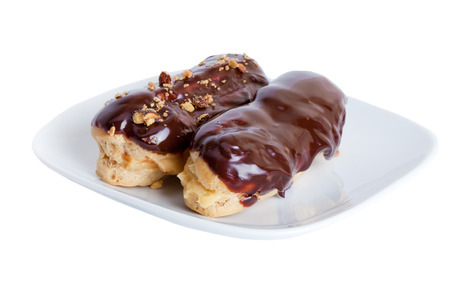 eclairs watered chocolate nut on white background
