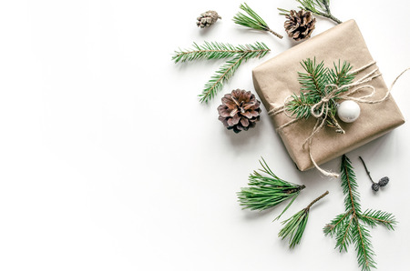 Christmas composition with a gift on a white background. Eco-style. Christmas background for presentation of work or text. Copy space. Top viewの写真素材