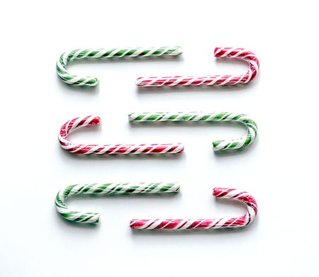 Christmas composition with sweet ice on a white background. A delicious magic cane.の写真素材