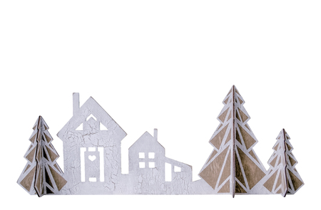 Christmas isolated wooden house with fir-trees. New Year's decor on windows or shelf. Christmas background for presentation of work or text. Copy spaceの写真素材