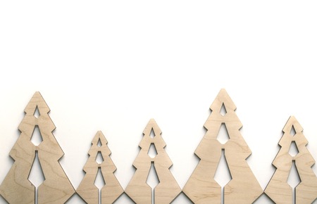 Composition with fur-trees from plywood. Christmas eco background for presentation of work or text. Beautiful greeting card. Copy spaceの写真素材