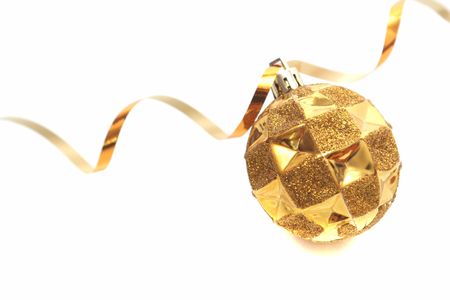 Gold New Year's toy and streamer on a white backgroundの写真素材
