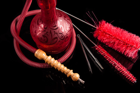 Red hookah on a black background